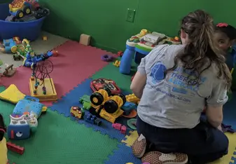 Playing with the children of Teach Me Early Childhood Development Center