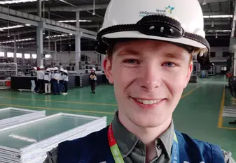Me at a factory with my colleagues.