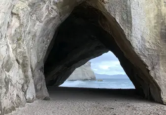 Te Whanganui-A-Hei (Cathedral Cove) Marine Reserve is on the Coromandel Peninsula in New Zealand. Approximately  an hour walk from the car park. Make sure to look up peak hours because it can get quite busy.