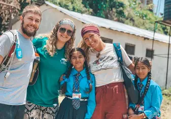 A few of the other volunteers and I with the children on Gorkha right before we taught them classes in courses such as English, Math, Social Studies, etc