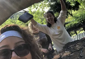 Pictured is myself and my best friend, creating the soil bags so we could later that day plant avocados individually!