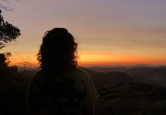 Remember my funny story that might not have been so funny to you? Here is the picture proof I made it to the top of the trail and watched the sun kiss the mountains and paint the sky as it rose at approximately 6:15am. The big random shadow you could see on the far left is a shadow of my head as well as some trees poking out form the forest. 