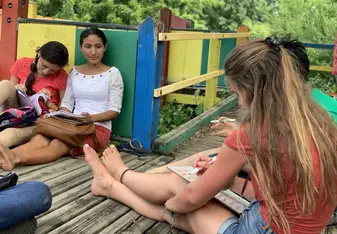 Teaching the advanced level students on the playground.