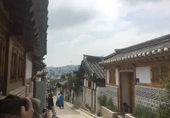 A path through a traditional village. Where traditional meets modern, a neighborhood nestled at the top of hill; a brief getaway from the city. 