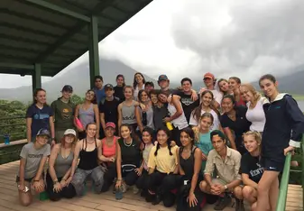 our group after a long day of community service and a hike at a national park with a volcano in the background