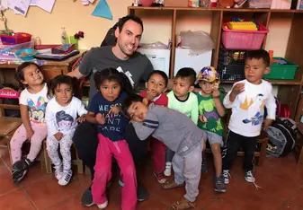 Me with the kids that I volunteered with in 2019 (my most recent experience)