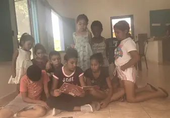 Kids listening to a story in one of the classrooms