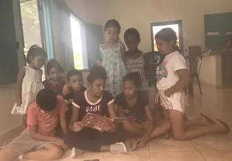 Kids listening to a story in one of the classrooms
