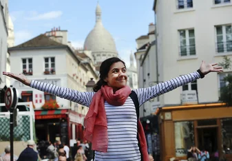 Girl with arms outstretched in French square
