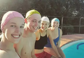 a sparkly clean pool (good work Austin!) and bathing caps to keep it that way