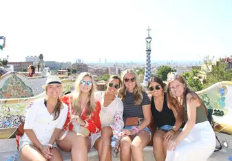 Group of girls in front of Gaudi's Parque Guell in Barcelona
