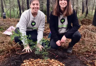 The first tree we planted at Greenpop's Festival of Action - me and my friend Bailey sitting proudly by our first tree!