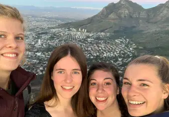 A selfie of me and my friends when we were climbing Lion's Head. 