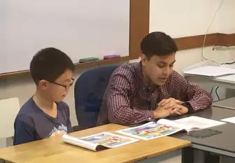Teacher working with student