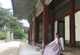At 경복궁 wearing a 한복