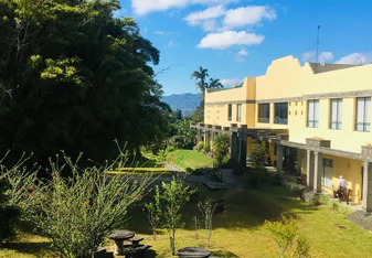 blue skies over a yellow Costa Rican building