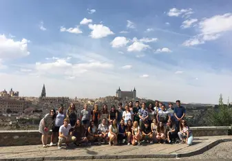 This is a picture of my group and the beautiful city behind us is Toledo.