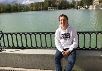 Sitting in front of the pond in the middle of Retiro Park