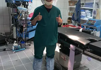 Here I am in my scrubs after finishing a surgery