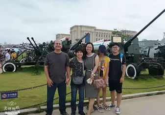 Me with my father and high school teacher's family at the Naval Museum