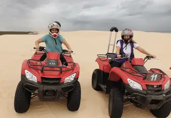 This me and my friend riding on quads through the sand dunes in Newcastle 