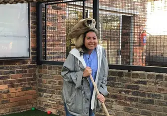 A gibbon sitting on my shoulders as I try to sweep