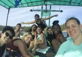 The Wild Tropics family taking a break on the upper deck of the boat between dives