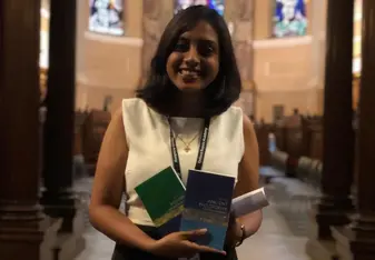 A picture of myself after our Graduation Ceremony with the books I won as my Attainment Awards for Philosophy and Contemporary History for topping the class.