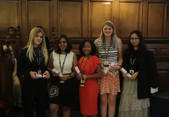 A picture of me collecting my Graduation Scroll besides my classmates.