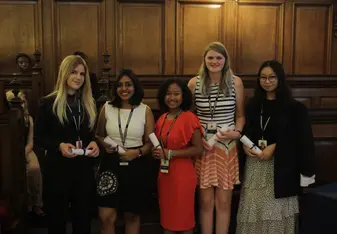 A picture of me collecting my Graduation Scroll besides my classmates.