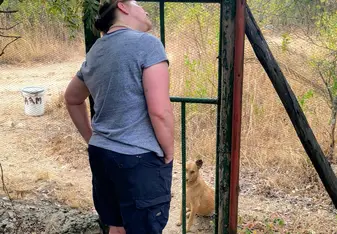 Checking-in on Millie the Eagle Owl with Tinkerbelle the dog patiently waiting outside.