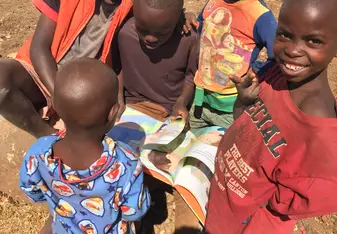 Some kids reading a book we brought!