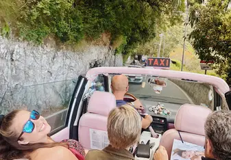 Riding in a pink taxi on the island of Capri