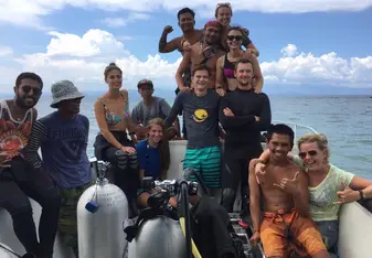 A photo of the fam on the boat after an amazing day of diving!