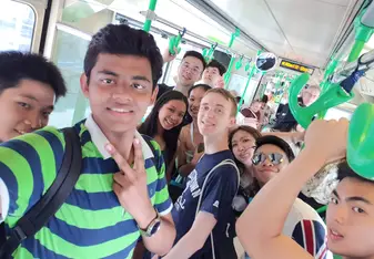 A group of friends on a Melbourne tram.