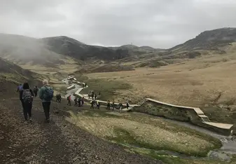 Hiking along the geothermal hot springs. Not only are they great natural hot tubs, hot springs also help produce a large fraction of Iceland's energy.