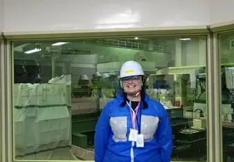 Me, standing in the small control room overlooking the refuel floor of Daini (cried right after this photo because it was so bad-ass)