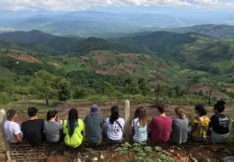 A group photo with the hills and fields of the Lisu Village in the background. Such a beautiful view that I will never forget. 