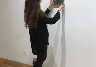 Hanging an artwork in the Gallery for the new exhibition