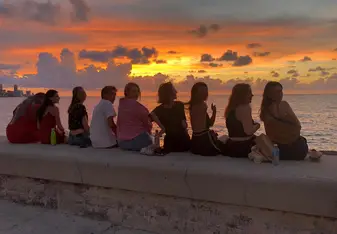 Enjoying sunsets at the Malecon with friends (from the hostal)