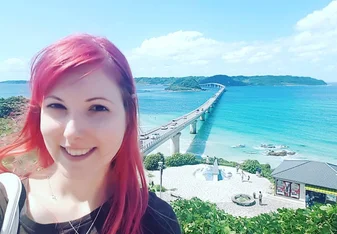 woman standing in front of ocean