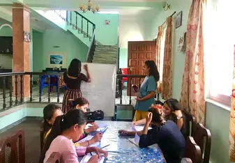 A group lesson, teaching English at SASANAE, an organisation for survivors of human trafficking.