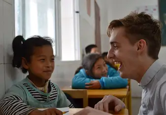 Teaching English to a group of happy students