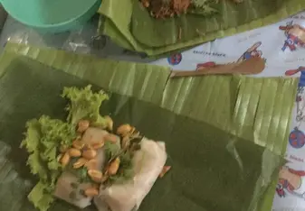 Some yummy food from the evening market wrapped in banana leaves.