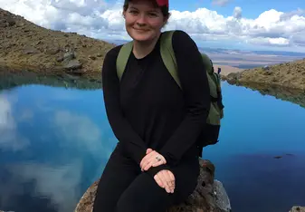 Me walking across a bridge during a hike in the Tararua range.