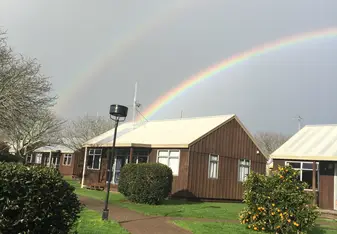 Double rainbow over the Orchard Park Residence cottages