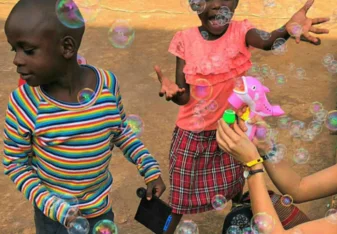 woman with children in Uganda