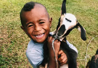 Tatchi (My "little brother") and his pet goat 