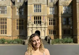 Me standing outside of the abbey on a sunny day