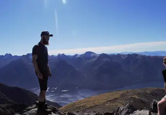 Relaxing at the highest point on Fiordland National Park's Kepler Track